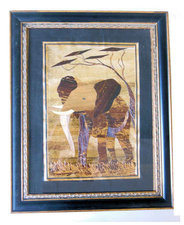 Tanzania- Intricately cut wood elephant on Fabric. Framed.