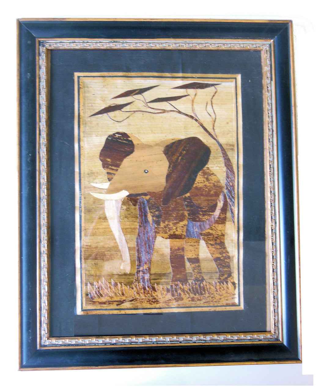 Tanzania- Intricately cut wood elephant on Fabric.  Framed.